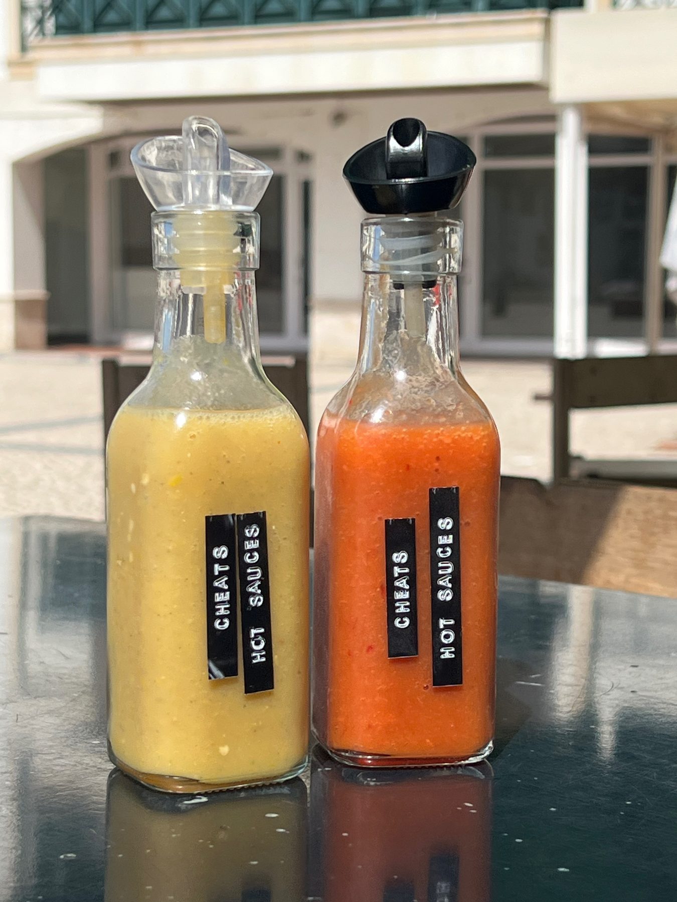 Homemade small-batch CHEATS hot sauces by Cheat Day in Ericeira, Portugal